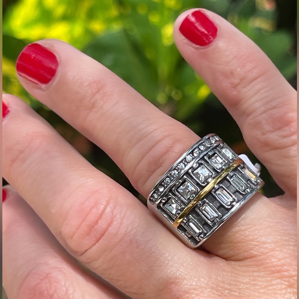 Elegant statement ring with silver and gold tones with crystal.
